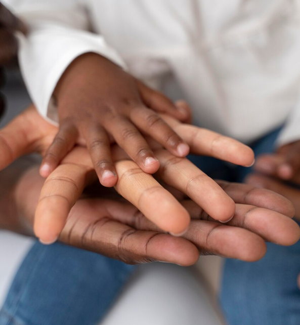 A family's hand on top of each other.