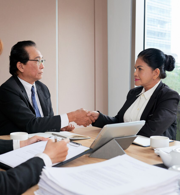 A Port St Lucie lawyer and a client are shaking hands.